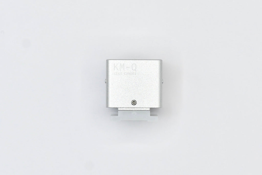 The KMQ chrome top display model from backside on a white background.