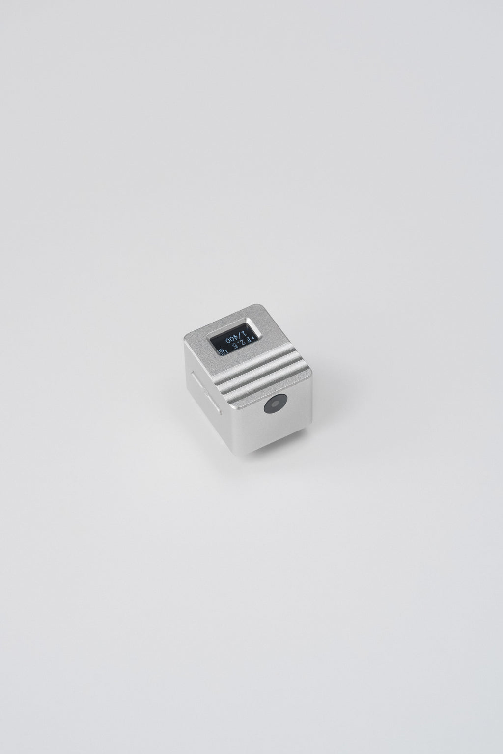 The KMQ chrome top display model from afar on a white background.