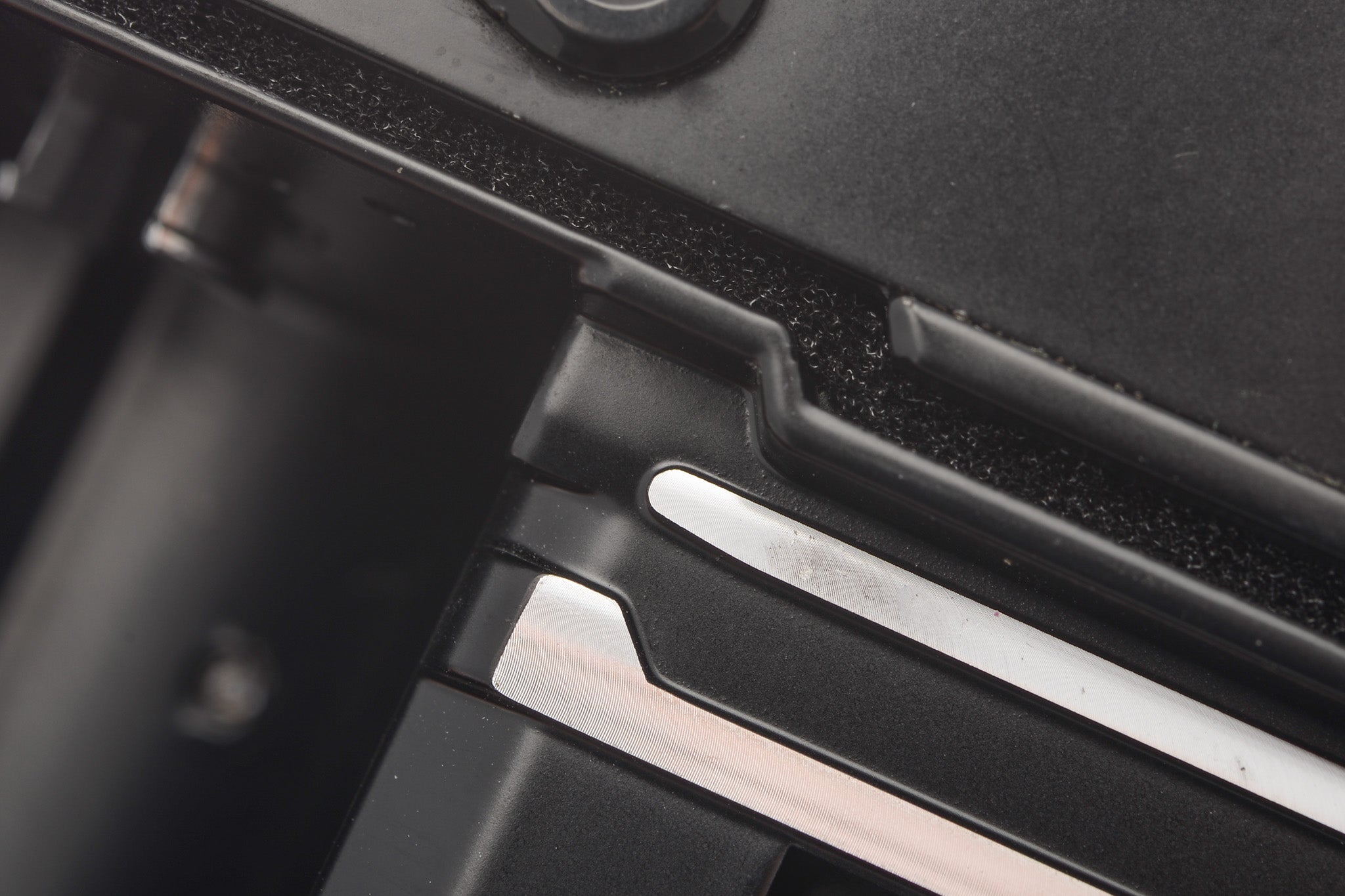 A very close-up of light seal foam on a camera body