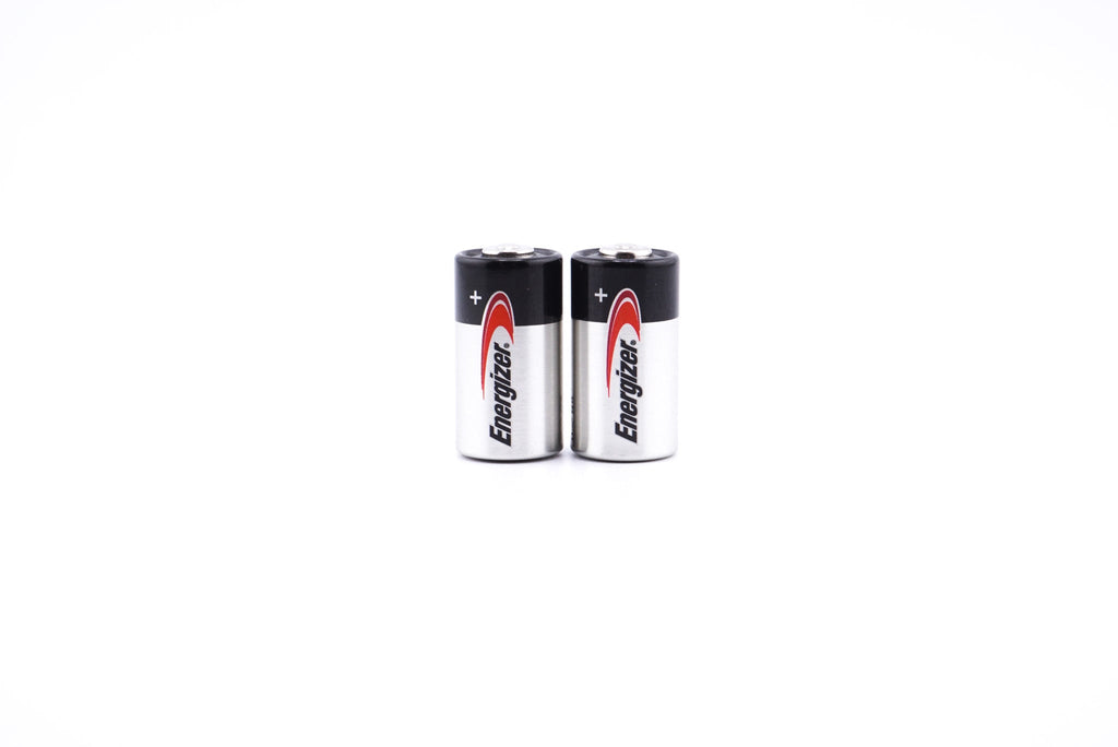 A close-up of Two Energizer 4LR44 / A544 6V batteries with a white background.
